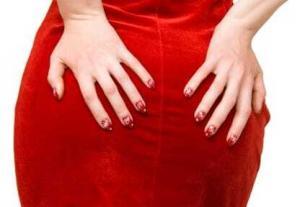 Woman hands on red dress