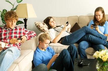 Teenagers using smartphones