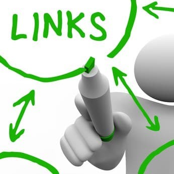 A person draws a series of links connecting in a network of referrals, representing a well search engine optimized website or an organization of connected people