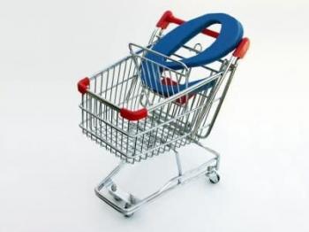 A miniature shopping cart isolated on white with a blue letter "E" in the basket depicting e-commerce or online shopping.