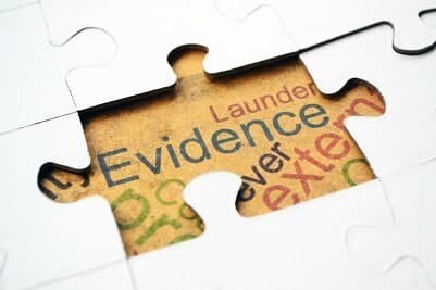 Jigsaw puzzle with word "evidence"