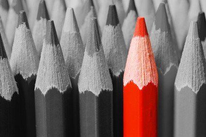 Red pencil among black and white