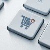 Does Your E-Commerce Site Have These 5 Features? Button with shopping cart icon on a modern computer keyboard.