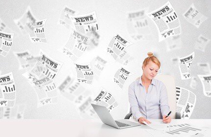 Woman surrounded by headlines