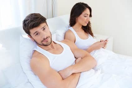 Husband while his internet addict wife is using mobile phone
