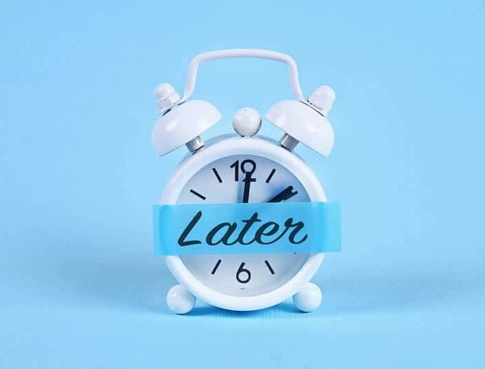 Alarm clock with the word "later" on it