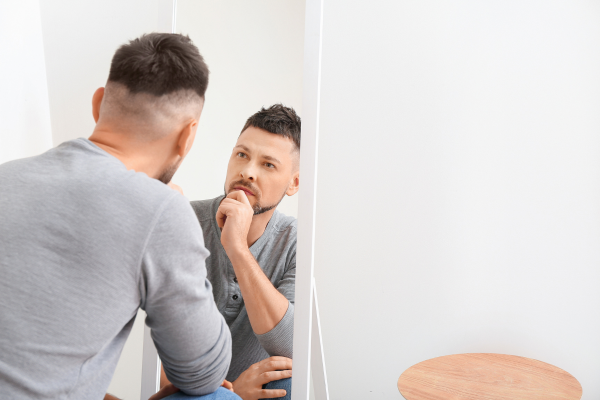Man looking in mirro